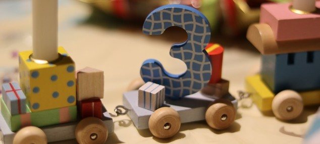 Toy train with number 3 block to represent managed services trends