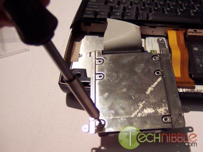 Screwing shield back onto the harddrive